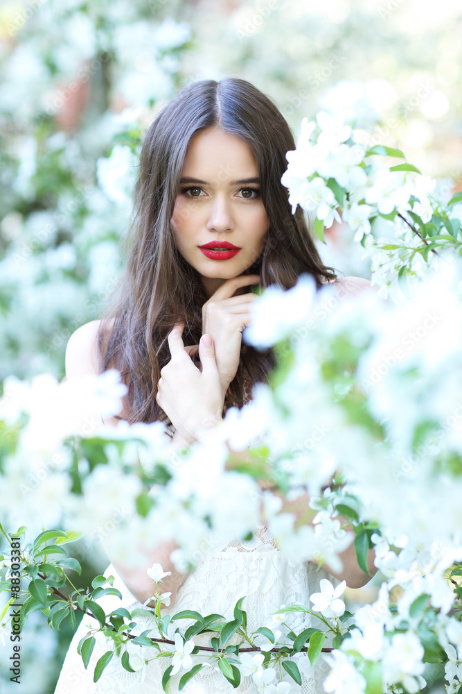 Portrait of young beautiful woman in spring blossom trees. Portrait of young beautiful woman in spring blossom trees.