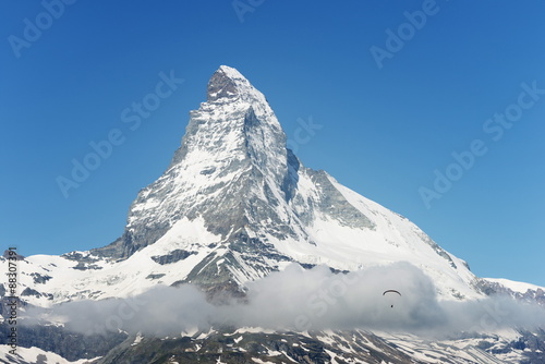 Paraglider flying near the Matterhorn, 4478m, Zermatt, Valais, Swiss Alps photo