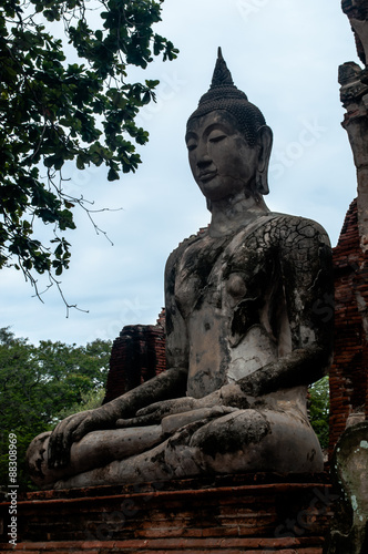 Large seated buddha statue in ruins of sukothai   Large seated buddha statue in ruins of sukothai thailand