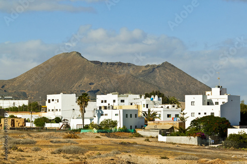 The Caldera de Gairia volcanic cone looms over this town in the central south, Tiscamanita, Fuerteventura, Canary Islands, Spain photo