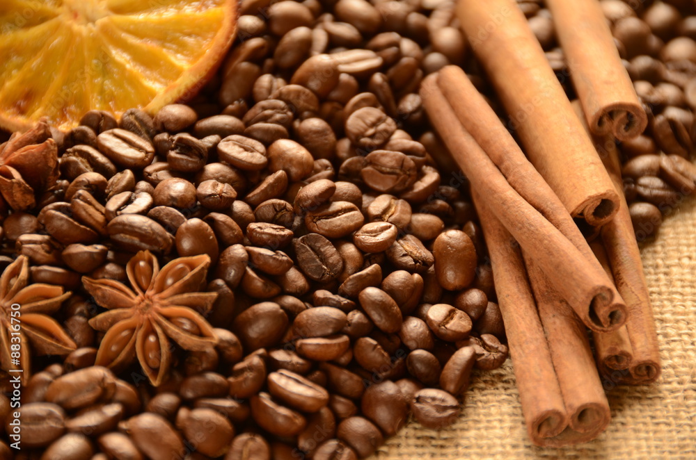 Coffee beans with cinnamon, banyan and orange slice Coffee beans with cinnamon, banyan and orange slice