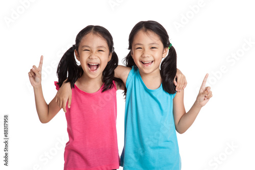 Happy Asian twins girls  smile point up