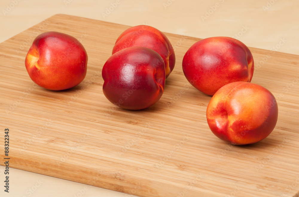 Fresh Nectarine Fruits On Wooden Board Fresh Nectarine Fruits On Wooden Board