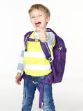 Boy with reflective vest shows thumb up