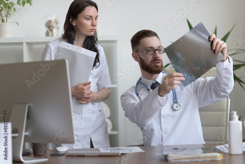 Wallpaper Mural Doctors discussing intestines Torontodigital.ca