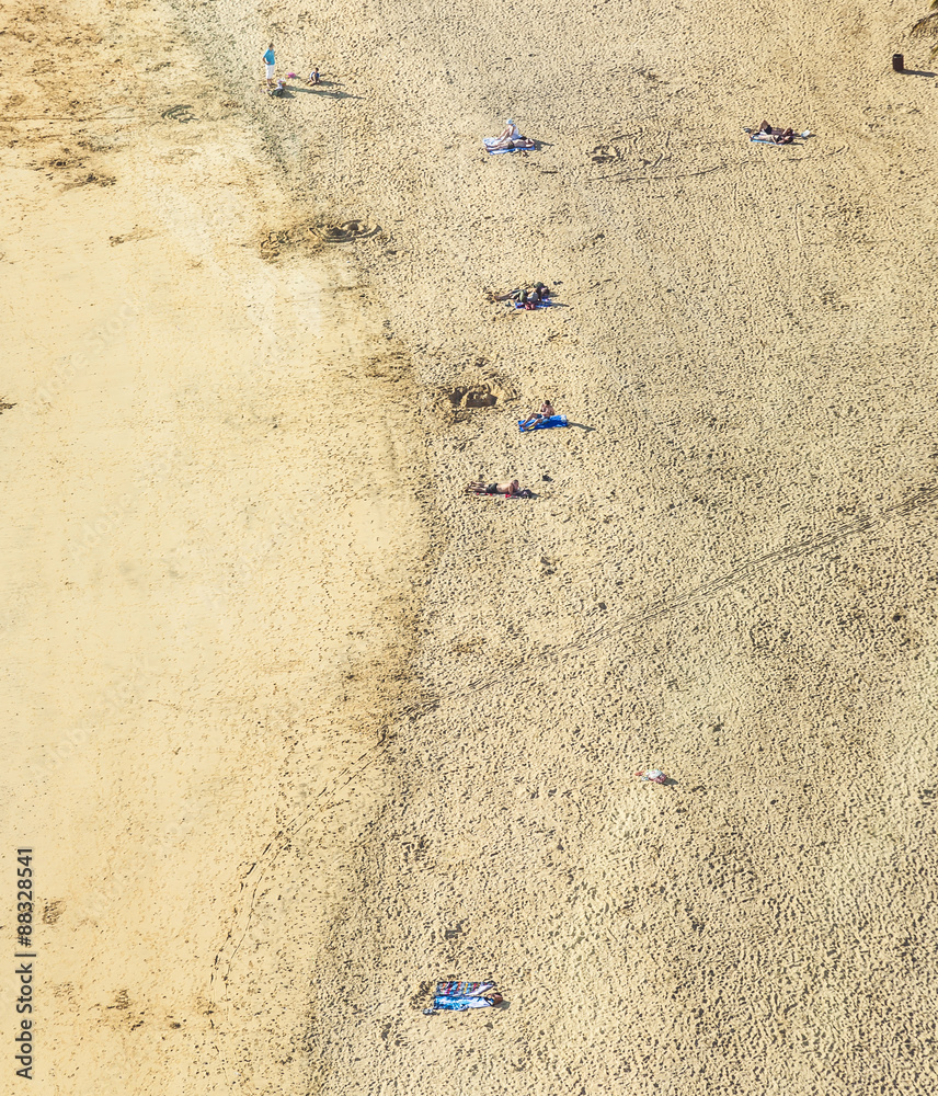 beach with tourists in summer in Arrecife, Spain