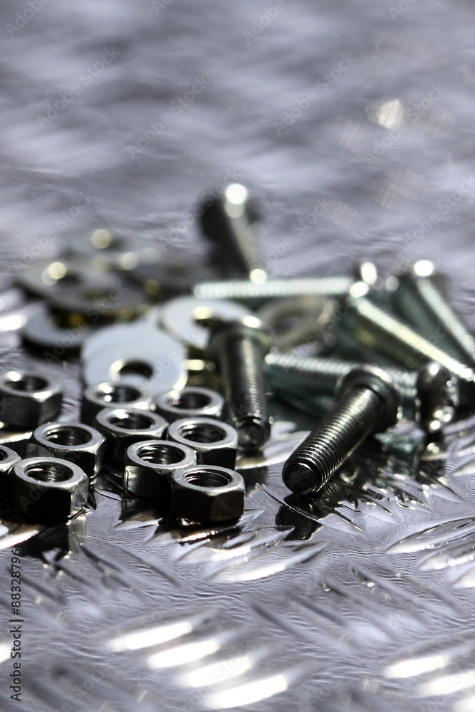 Nuts bolts washers.
Various nuts bolts and washers on a steel background. Nuts bolts washers.
Various nuts bolts and washers on a steel background.