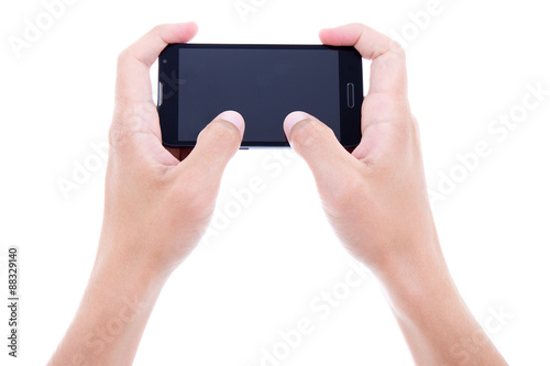 close up of male hands using mobile smart phone with blank scree
