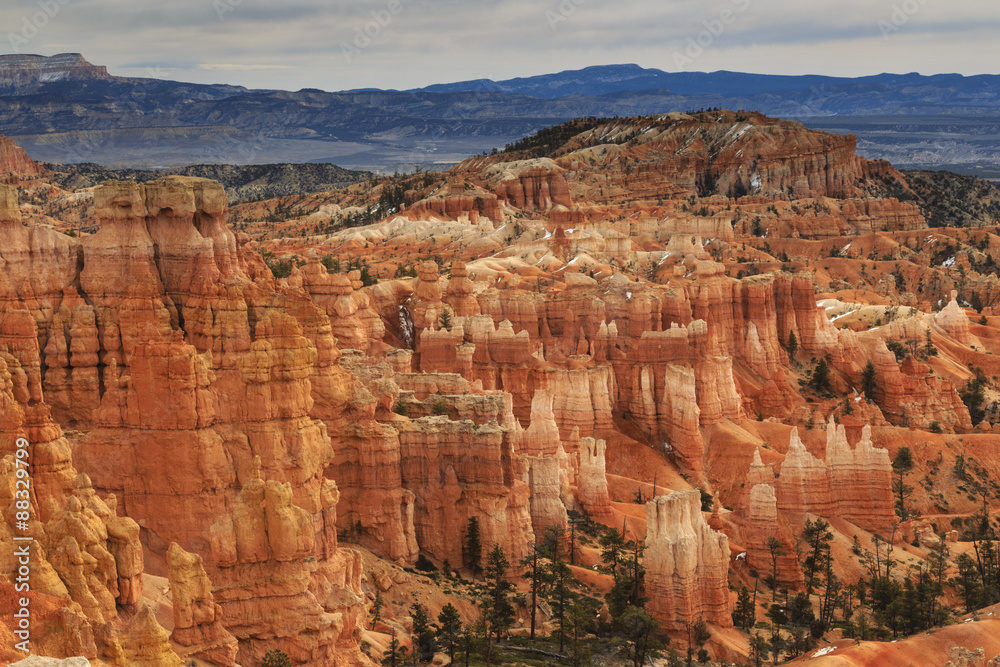 Hoodoos and cloudy sky in winter, Rim Trail near Sunrise Point, Bryce Canyon National Park, Utah Hoodoos and cloudy sky in winter, Rim Trail near Sunrise Point, Bryce Canyon National Park, Utah