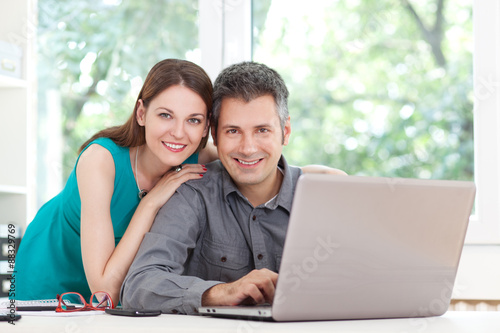 Young couple using laptop
