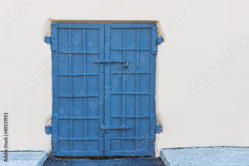 Steel old blue door on a background