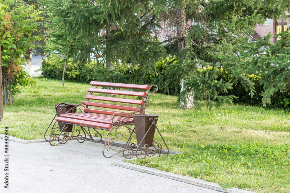 Bench in the park, relax after a hard day Bench in the park, relax after a hard day