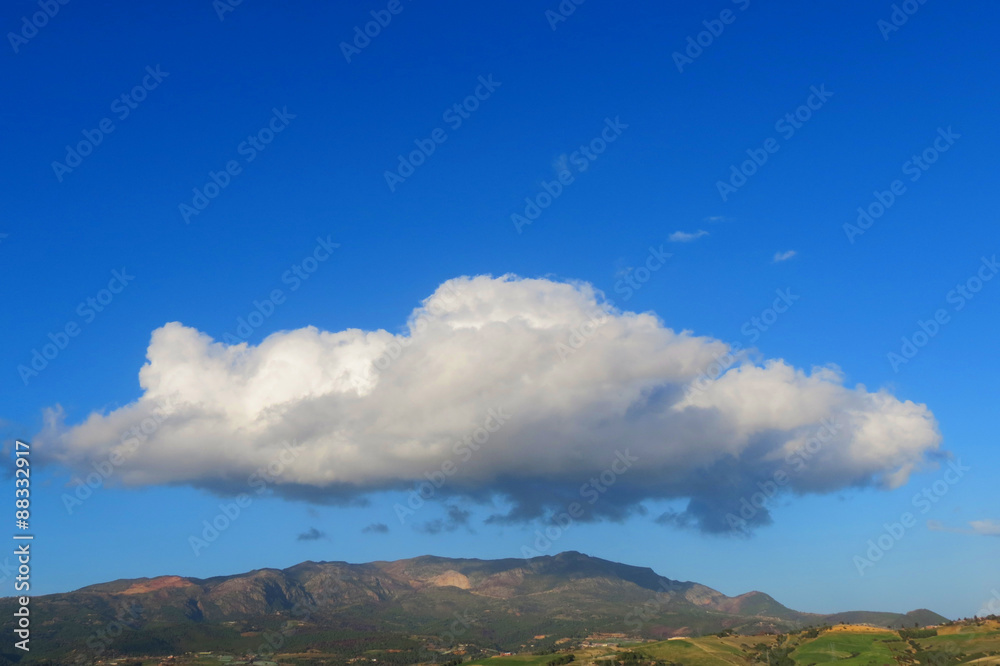Strange cloud on mountain and a bleu sky