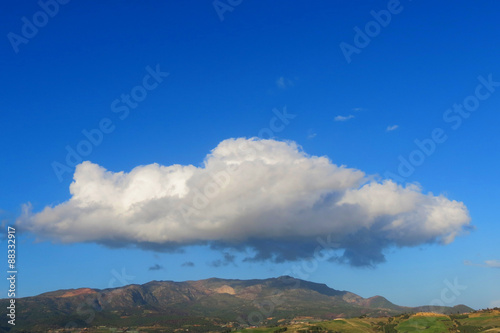 Strange cloud on mountain and a bleu sky © aadem