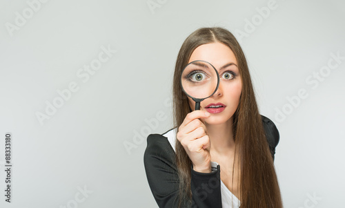 beautiful girl with a magnifying glass