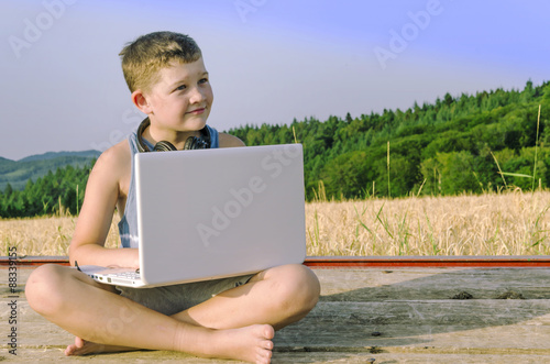 Country boy with gadgets in the field.