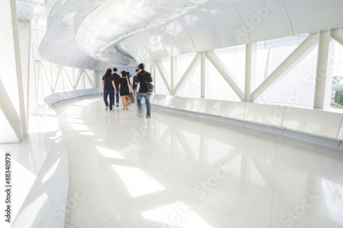 Business people walking in the office corridor.