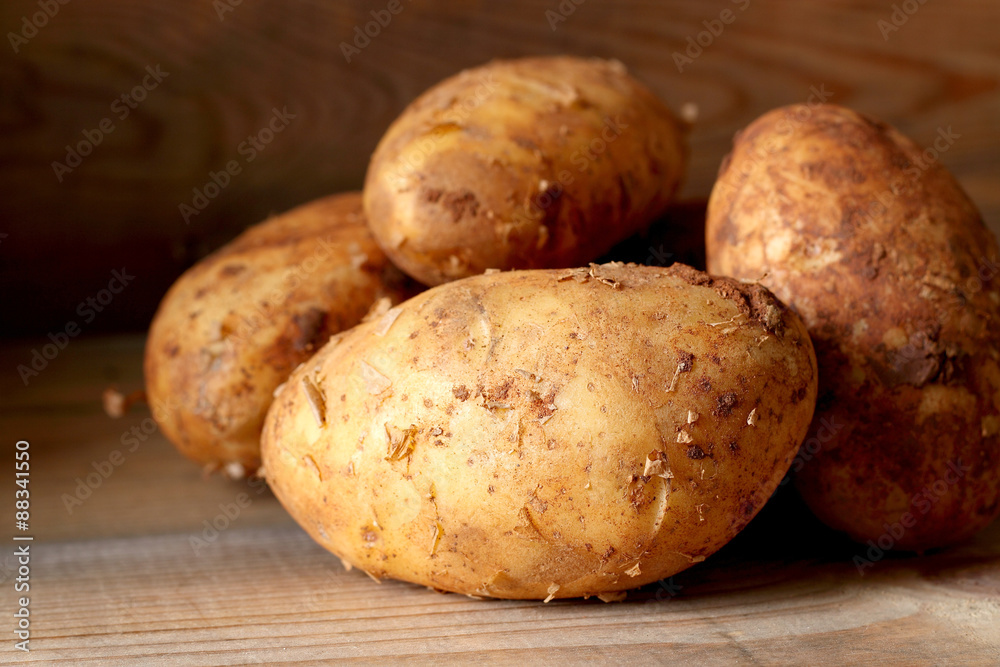 Potatoes.
Potatoes on a wooden surface. Potatoes.
Potatoes on a wooden surface.