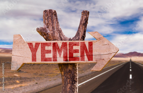 Yemen wooden sign with desert road background