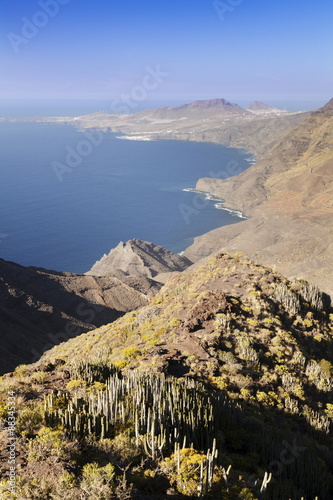 Rocky coastline, Anden Verde, West Coast with Puerto de las Nieves and Faneque Mountain, Tamadapa Natural Park, Gran Canaria, Canary Islands, Spain, Atlantic photo