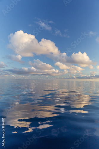 Reflected clouds in calm seas near the island of Deserta Grande, in the Ilhas Desertas, near Funchal, Madeira, Portugal, Atlantic photo