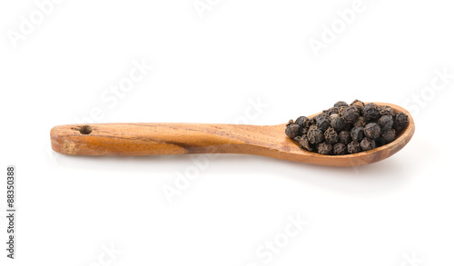 Black pepper with wood spoon