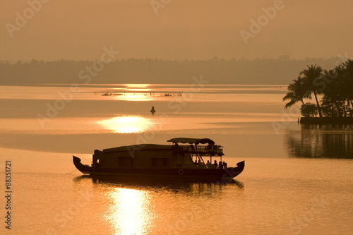 Houseboat at dusk in Ashtamudi Lake, Kollam, Kerala photo