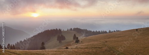 Early morning fog and sunrise, Belchen Mountain, Black Forest, Baden Wurttemberg, Germany photo