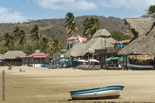 Little boat on the beach at this popular tourist hub for the southern surf coast, San Juan del Sur, Rivas Province, Nicaragua photo