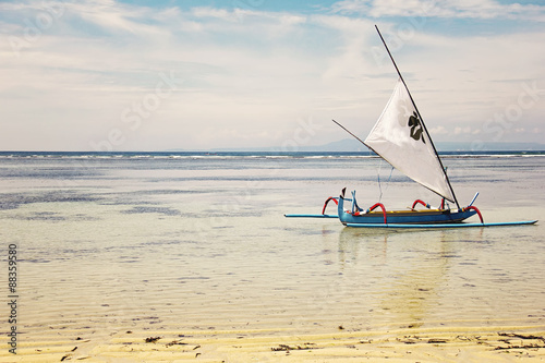 Traditional Jukung boat on water