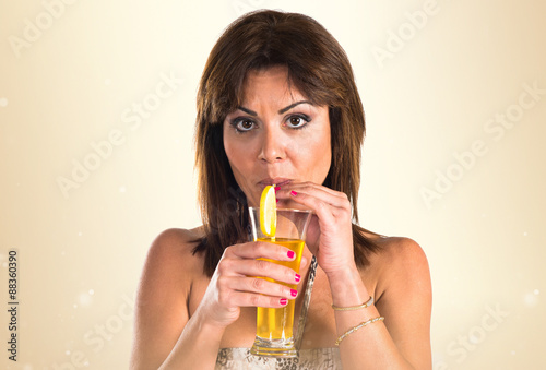 Girl in bikini drinking a cocktail