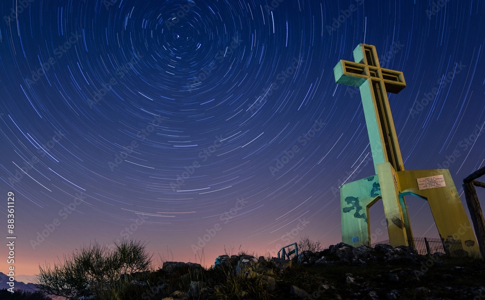 Startrails over a World War II cross memorial in Tuscany, Italy