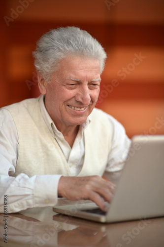 Senior man with laptop