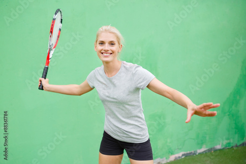 Girl tennis player on the court with a racket. © ilya_oreshkov