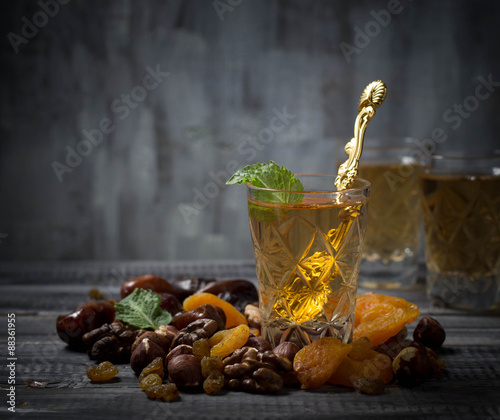 Traditional arabic tea and dry fruits photo