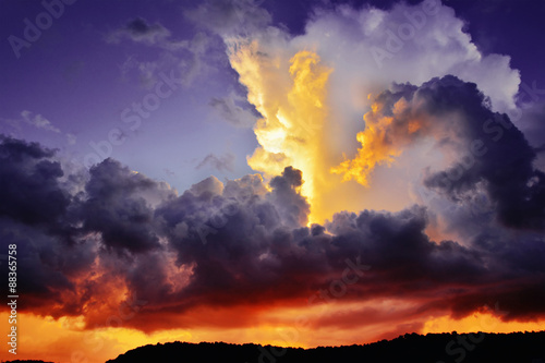 Photography Dramatic dark purple and red storm clouds at sunset