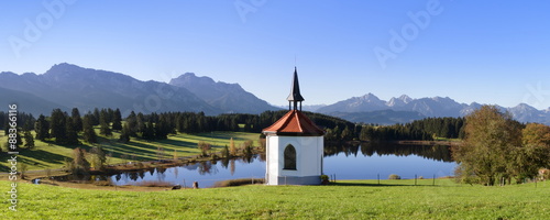 Chapel at Hergratsrieder See lake with Allgau Alps, near Fussen, Allgau, Ostallgau, Bavaria, Germany photo