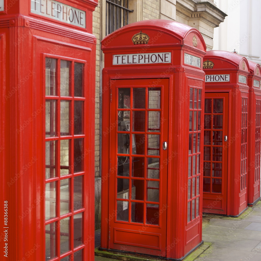 Row of red telephone booths design by Sir Giles Gilbert Scott, near Covent Garden, London Row of red telephone booths design by Sir Giles Gilbert Scott, near Covent Garden, London