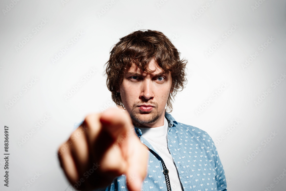 Closeup portrait angry young business man, guy, mad worker Closeup portrait angry young business man, guy, mad worker