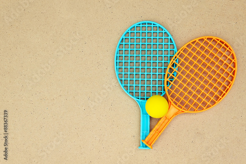 Tennis rackets and ball on the table © annakukhmar