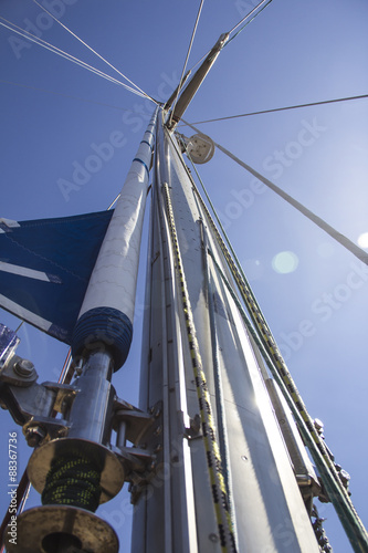 nautical part of a yacht with cords, rigging, sail, mast, anchor, knots photo