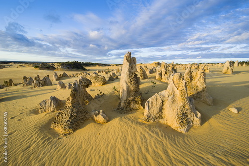 The Pinnacles limestone formations at sunset in Nambung National Park, Western Australia 