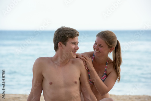 Young woman and man on the beach