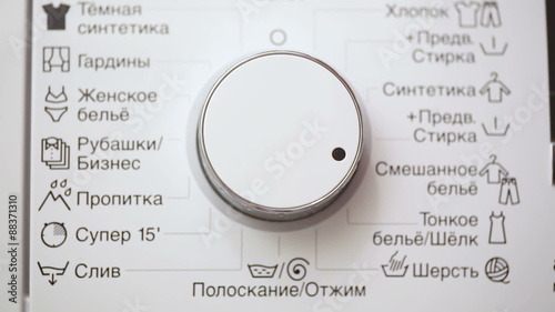 Hand Turning Washing Machine Appliance Dial