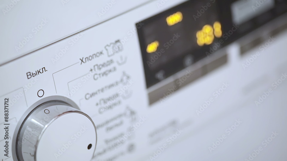 Hand Turning Washing Machine Appliance Dial Hand Turning Washing Machine Appliance Dial