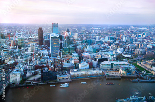 LONDON, UK - APRIL 15, 2015: City of London panorama in sunset and first night lights.