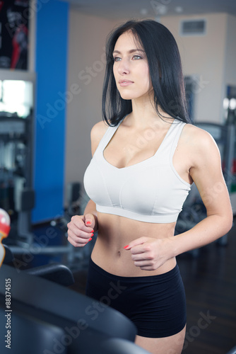 Free Download Portrait of pretty girl training on special sport equipment in g - GFXLoad