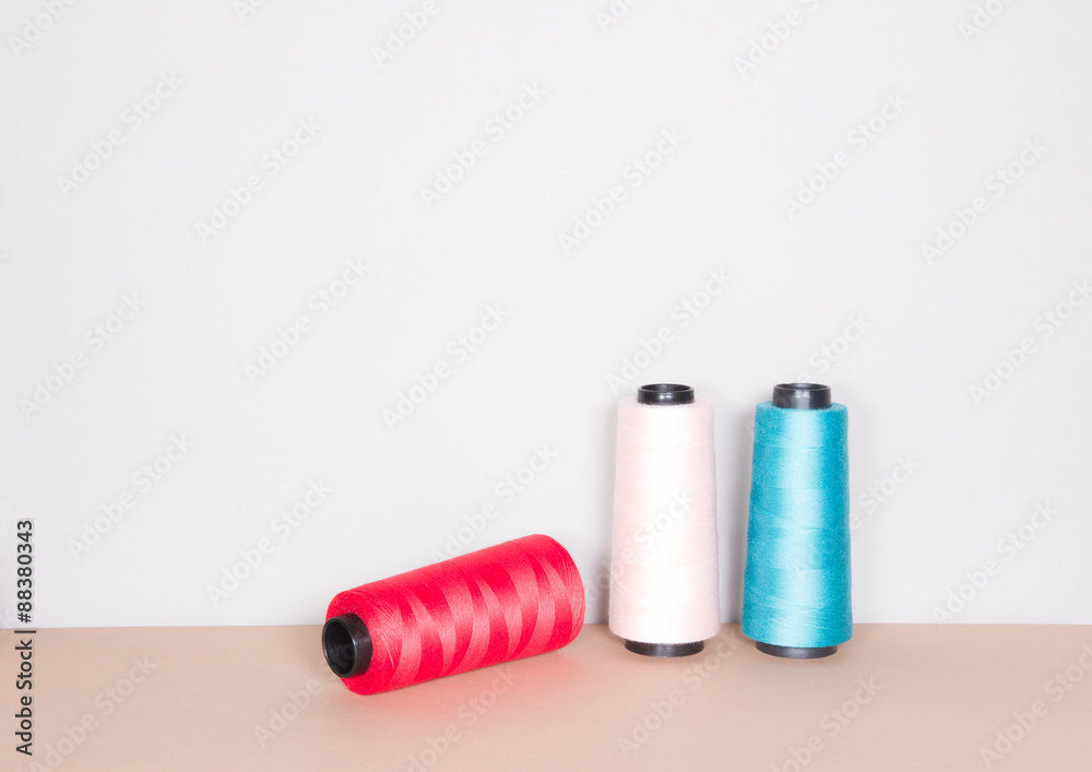 Multicolor sewing threads on clear background Multicolor sewing threads on clear background