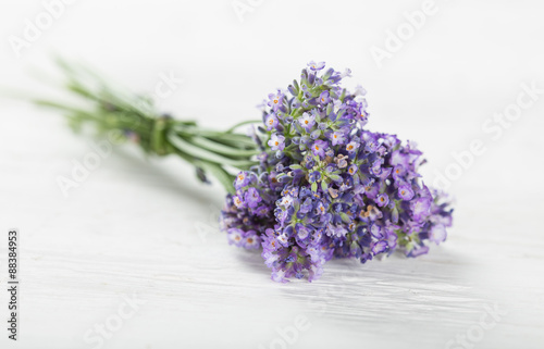 Lavender flowers on wooden table.