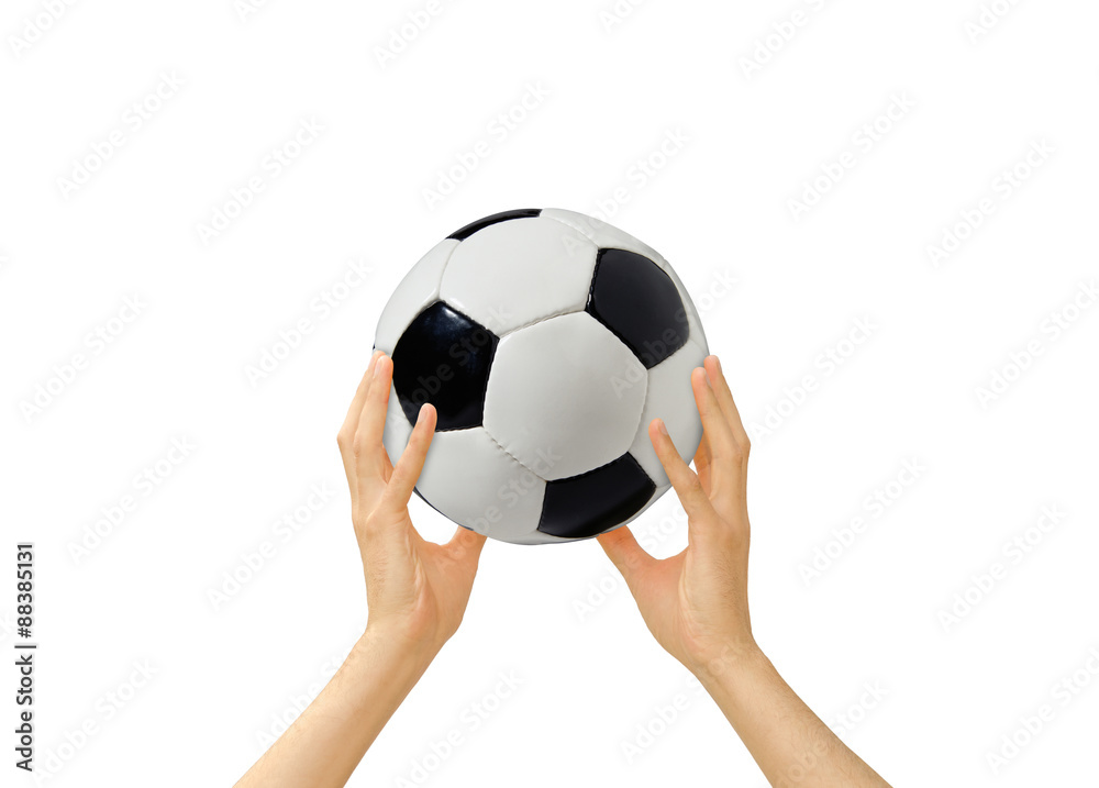 soccerball in a hand on a white background